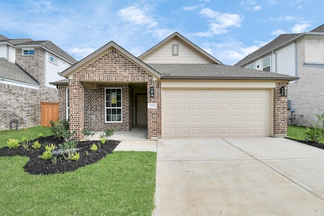 view of front facade with a front lawn, a garage, a shingled roof, brick siding, and concrete driveway