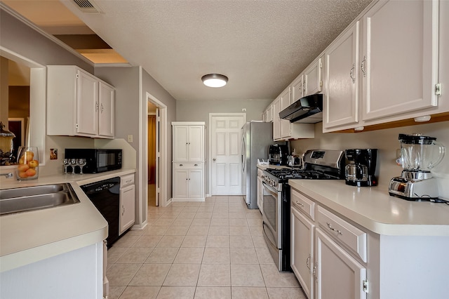 kitchen with white cabinets, light tile patterned floors, sink, a textured ceiling, and black appliances