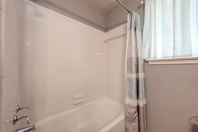 bathroom with shower / tub combo