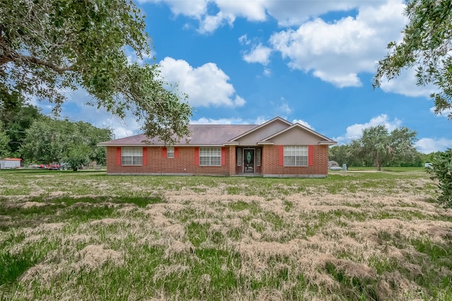 ranch-style house with a front yard