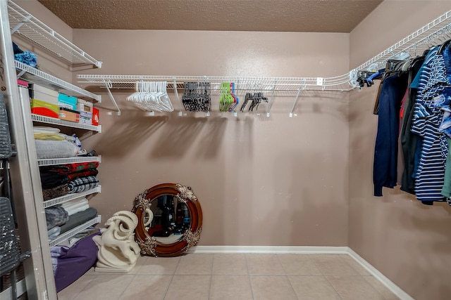 walk in closet featuring light tile patterned floors