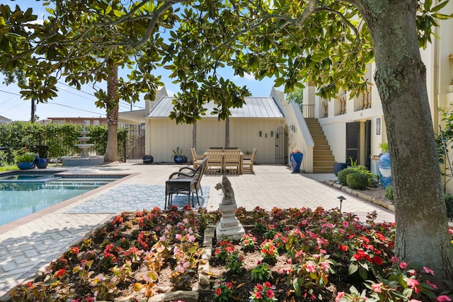 exterior space featuring a patio area and a fenced in pool