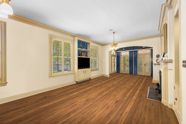 unfurnished living room featuring a notable chandelier, ornamental molding, and hardwood / wood-style flooring