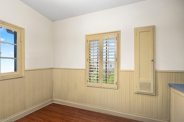 spare room featuring dark hardwood / wood-style floors