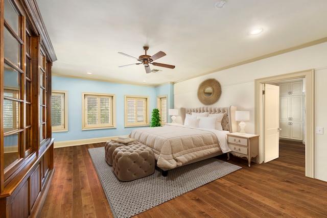 bedroom with ceiling fan, dark hardwood / wood-style floors, and crown molding