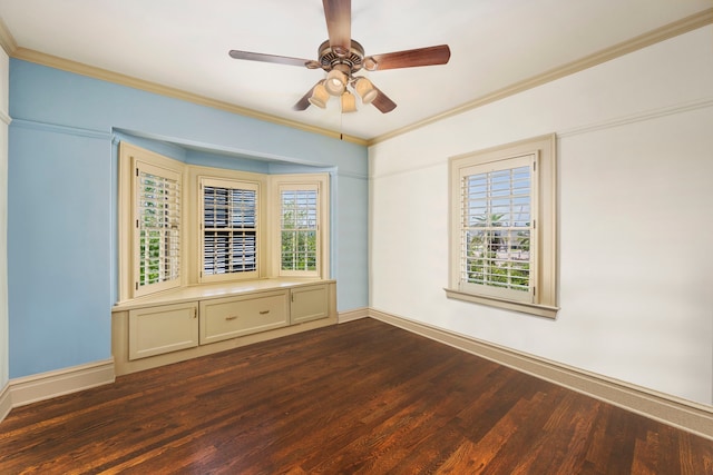 empty room with hardwood / wood-style flooring, ornamental molding, and ceiling fan