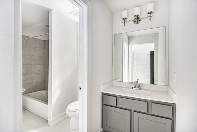 full bathroom with tiled shower / bath, toilet, tile patterned flooring, and vanity