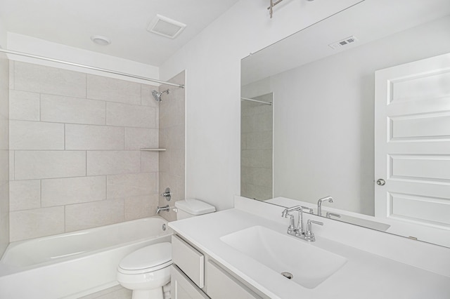 full bathroom with toilet, tiled shower / bath combo, and vanity