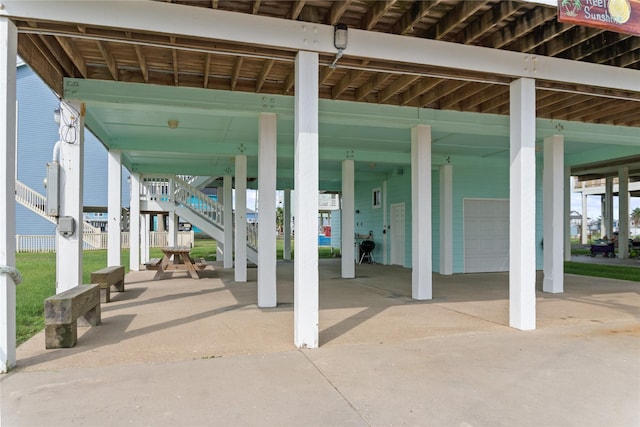 833 S Oneal Rd, Crystal Beach, TX 77650 - view of patio / terrace featuring stairs and a carport