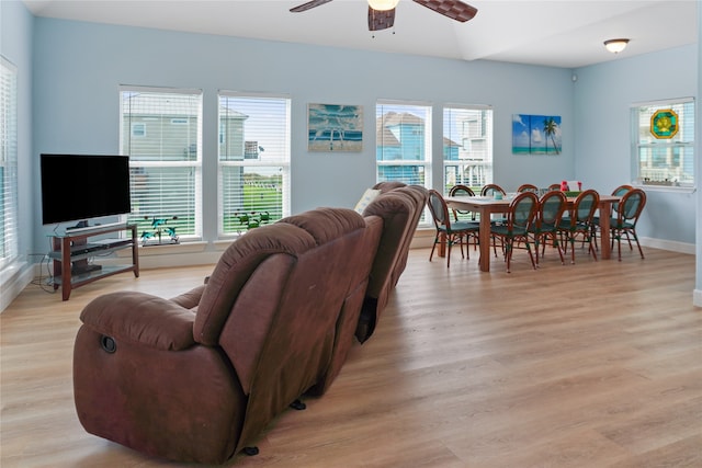 living room with a healthy amount of sunlight, ceiling fan, and light hardwood / wood-style floors