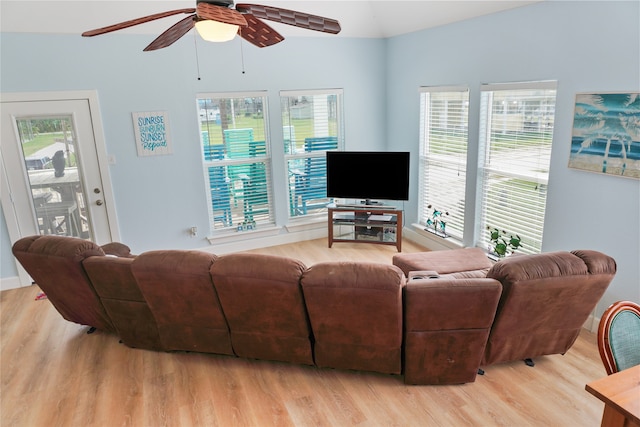 living room featuring a wealth of natural light, ceiling fan, and light hardwood / wood-style floors