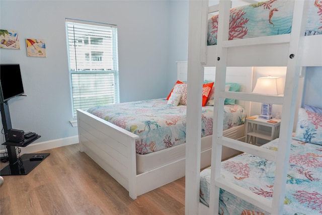 833 S Oneal Rd, Crystal Beach, TX 77650 - bedroom featuring wood finished floors and baseboards