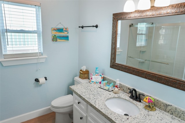 833 S Oneal Rd, Crystal Beach, TX 77650 - full bathroom with toilet, baseboards, vanity, and a shower with door