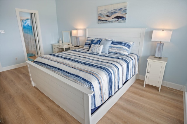 833 S Oneal Rd, Crystal Beach, TX 77650 - bedroom with light wood-style floors and baseboards