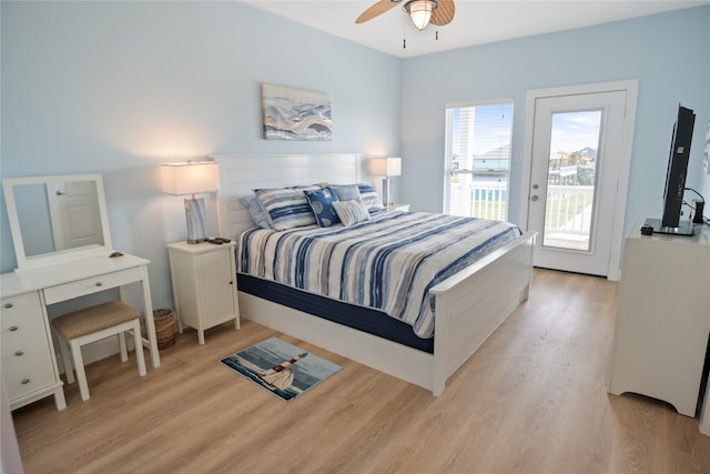 bedroom with ceiling fan, access to exterior, and light hardwood / wood-style flooring