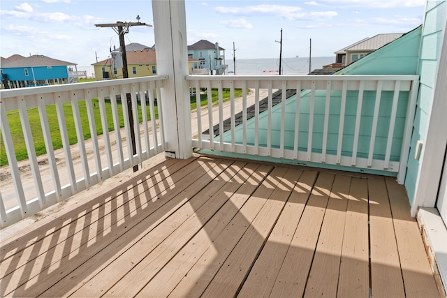 wooden deck with a water view