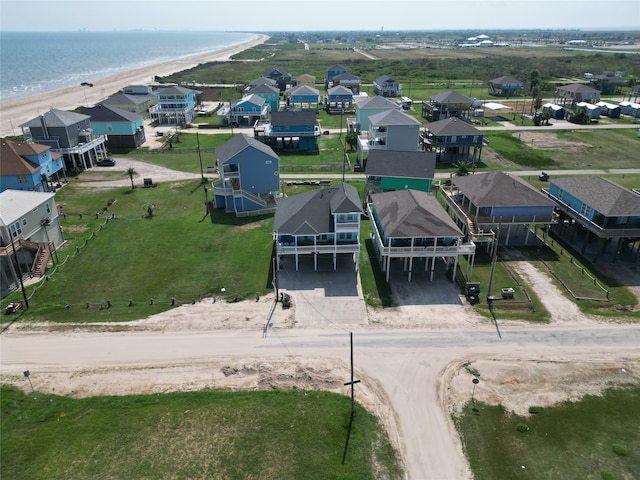 drone / aerial view featuring a view of the beach and a water view