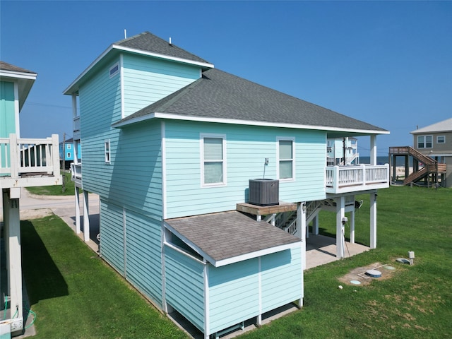 back of house with a yard and a wooden deck