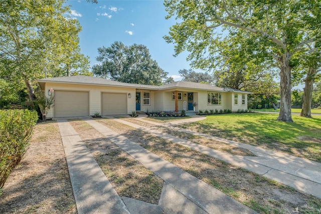 ranch-style home with a garage, covered porch, and a front yard