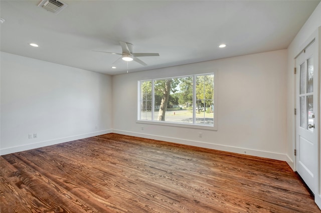 unfurnished room featuring recessed lighting, visible vents, baseboards, and wood finished floors