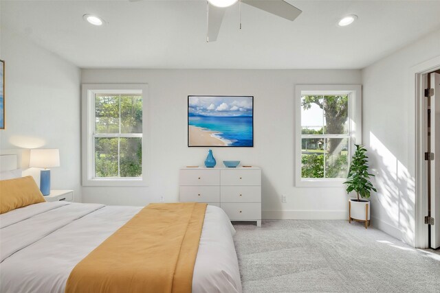 carpeted bedroom featuring ceiling fan, baseboards, and recessed lighting