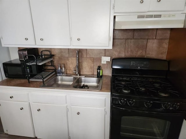 kitchen featuring sink, black appliances, white cabinetry, and tasteful backsplash