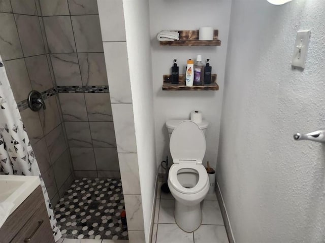 bathroom with tile patterned floors, vanity, toilet, and a shower with shower curtain