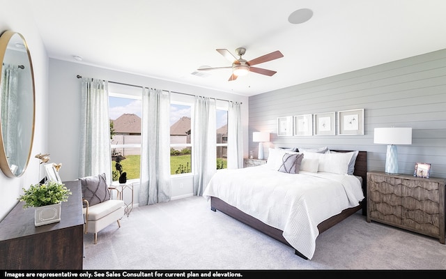 carpeted bedroom featuring ceiling fan