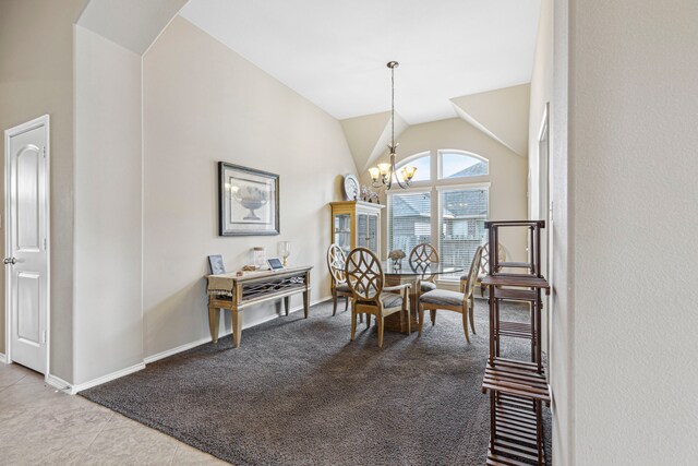 tiled dining room with high vaulted ceiling and an inviting chandelier