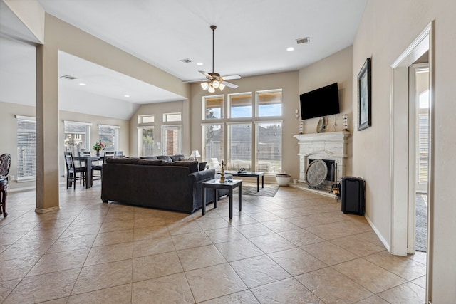 living room with ceiling fan and light tile patterned floors