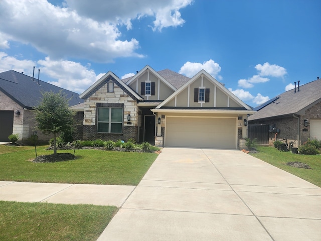 craftsman house featuring a garage and a front yard