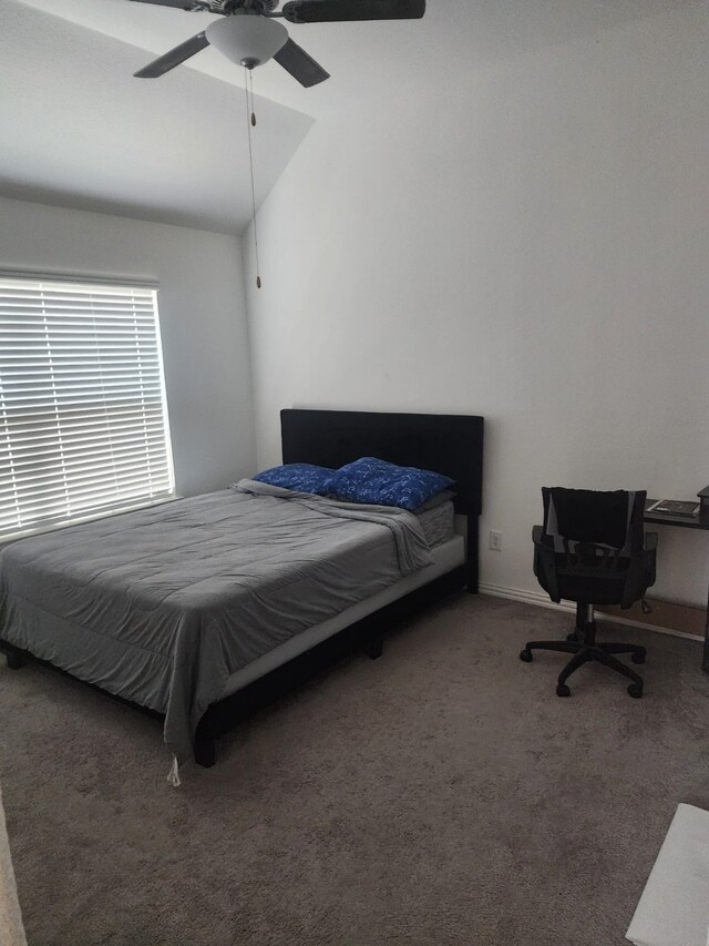 carpeted bedroom featuring ceiling fan and lofted ceiling