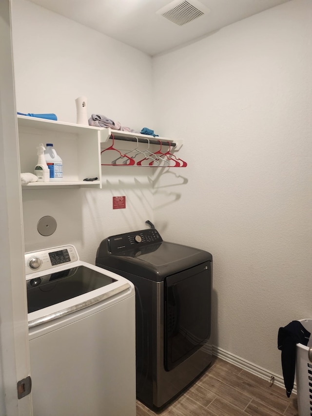 laundry area featuring washing machine and clothes dryer