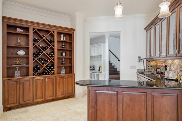 wine cellar featuring light tile patterned flooring and ornamental molding