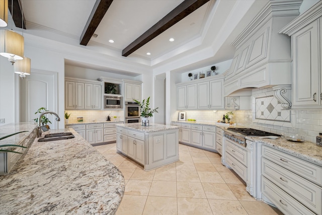 kitchen with backsplash, a kitchen island with sink, beamed ceiling, and sink