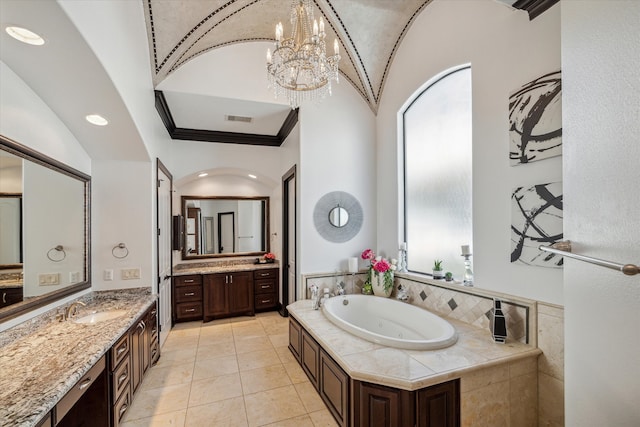 bathroom with vanity, ornamental molding, tile patterned floors, a bath, and an inviting chandelier