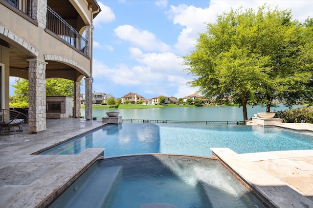 view of pool featuring an in ground hot tub and a patio area