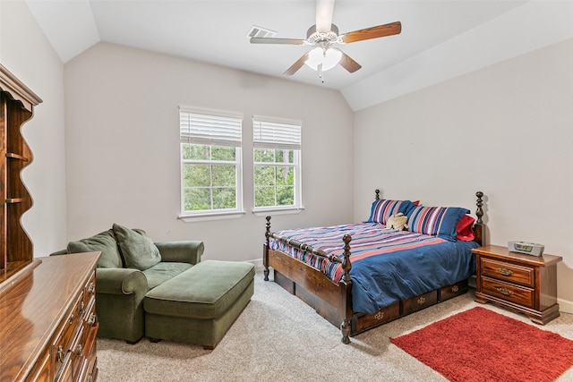 bedroom featuring ceiling fan, light carpet, and vaulted ceiling