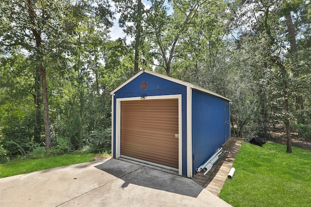 view of outbuilding featuring a lawn