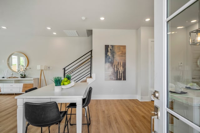 dining space featuring light wood-type flooring