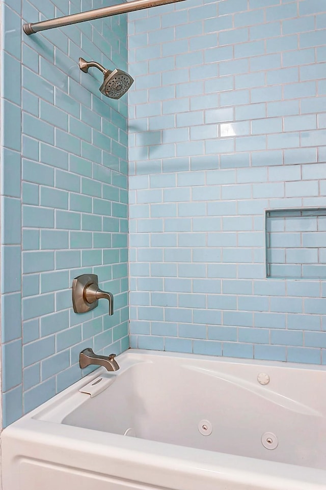 full bath with a combined bath / shower with jetted tub