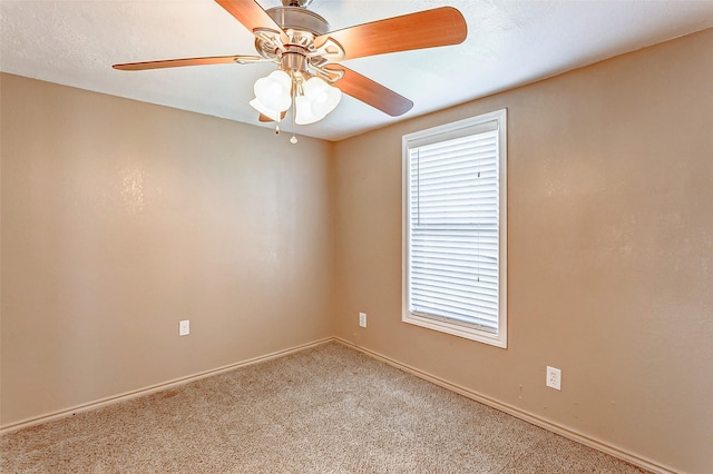 unfurnished room featuring ceiling fan, carpet flooring, and baseboards