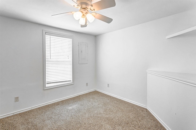 carpeted spare room with ceiling fan