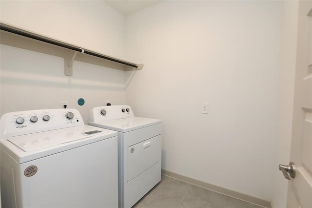 washroom featuring light tile patterned floors and separate washer and dryer