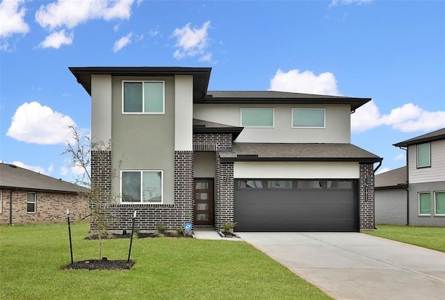 view of front facade featuring a front yard and a garage