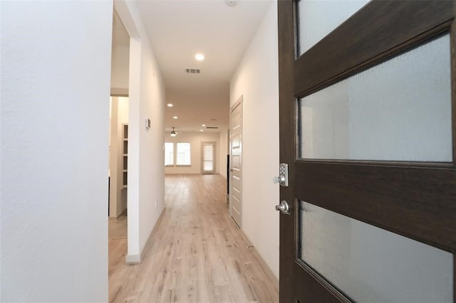 hallway featuring light hardwood / wood-style flooring