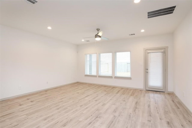 unfurnished room with light hardwood / wood-style floors and ceiling fan