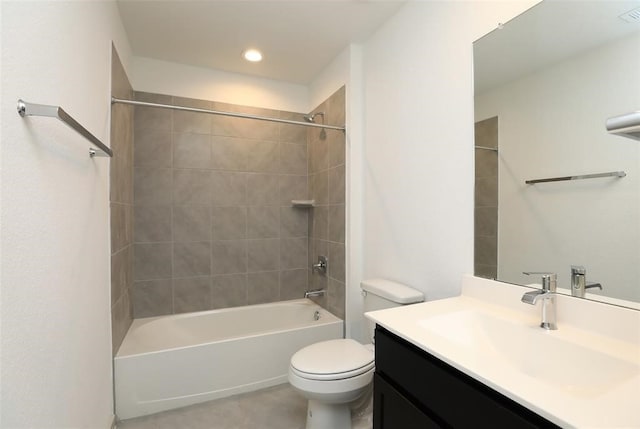 full bathroom with tiled shower / bath combo, tile patterned floors, toilet, and vanity