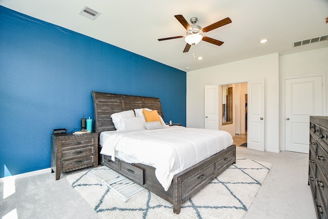 bedroom featuring ceiling fan and light carpet