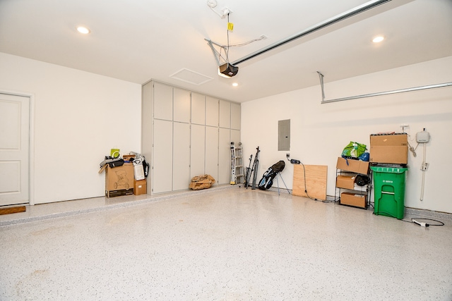 garage featuring a garage door opener and electric panel